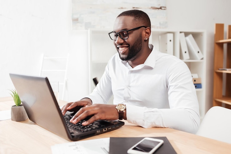 https://motivated-counseling.com/wp-content/uploads/2022/09/portrait-smiling-african-american-businessman-white-shirt-eyewear-sitting-working-his-laptop-office-isolated_574295-456.jpg